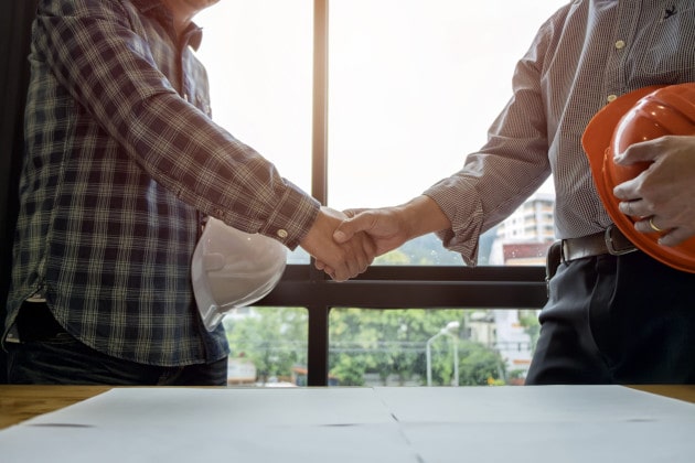 Workers shaking hands