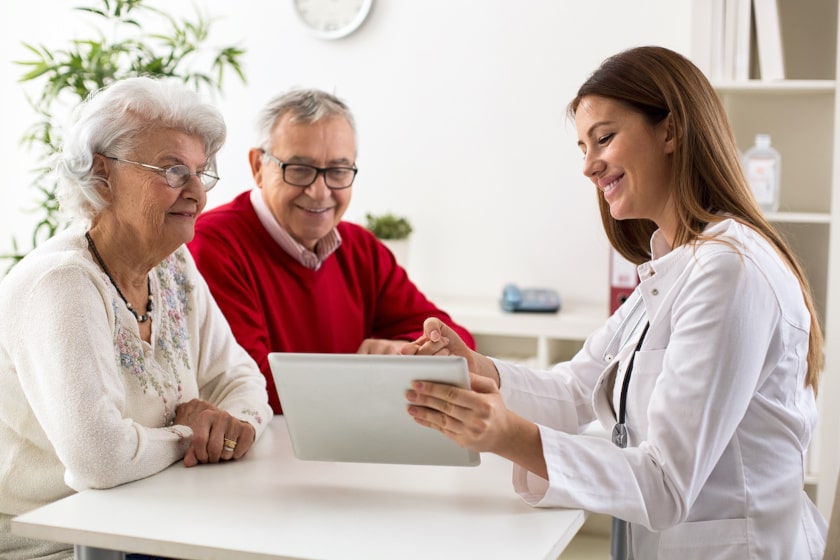 doctor and patients doing digital satisfaction survey on tablet