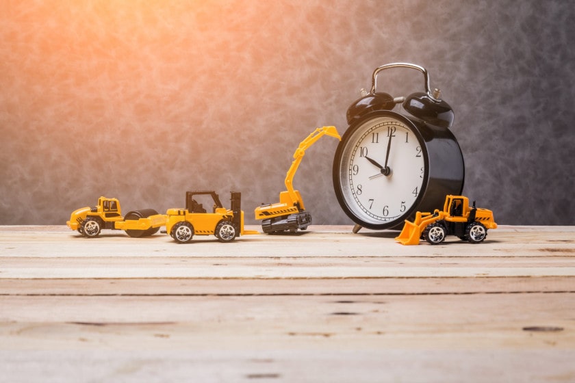 construction equipment model with clock to stay on time