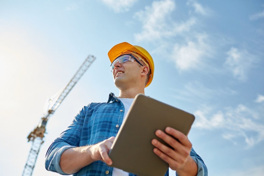 Construction worker using mobile forms