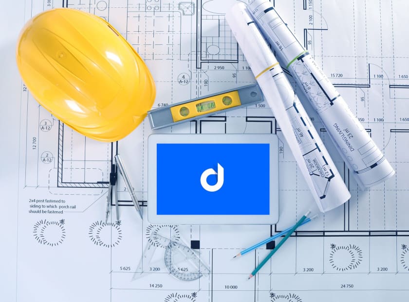 Device Magic forms app on tablet on construction blueprints workspace