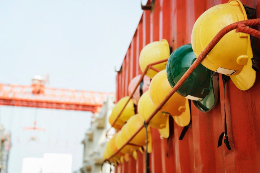 construction hard hats hanging at construction site