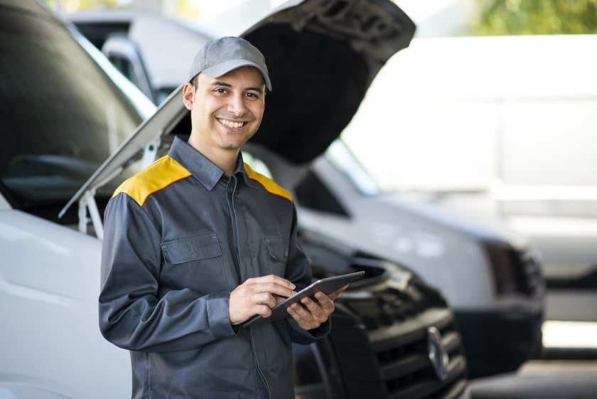 man doing a digital daily truck inspection report on a tablet