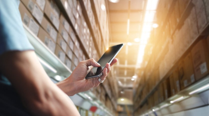 A mobile worker uses a mobile data collection app on his smartphone.