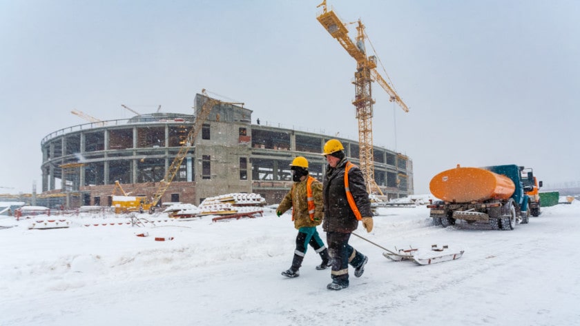 Construction workers on the jobsite during the winter season