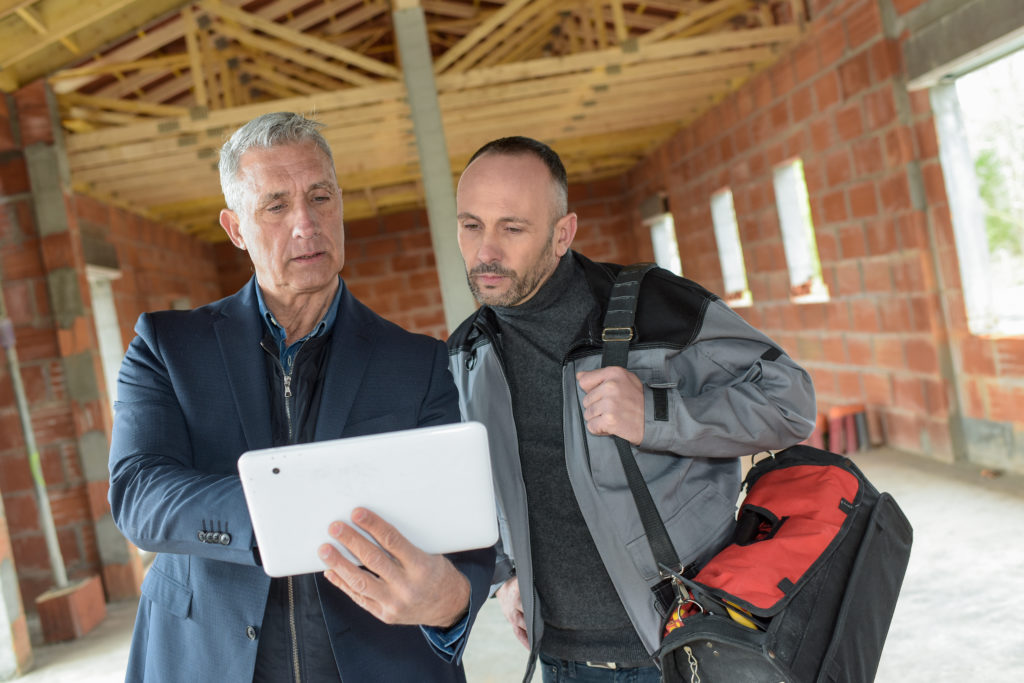 Construction subcontractor looking at digital forms